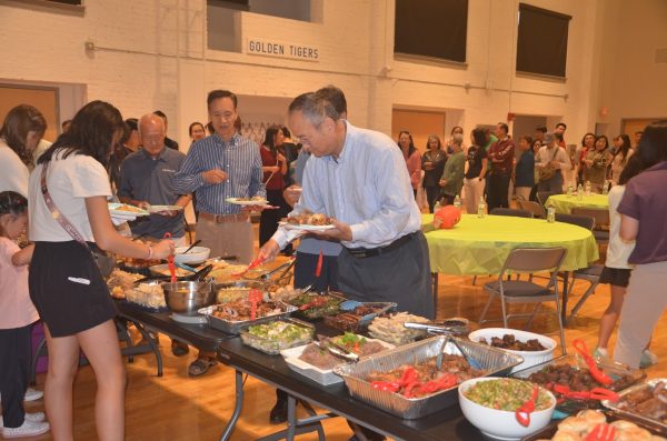 Traditional dishes and cultural activity booths were featured at the Langston Centre. 